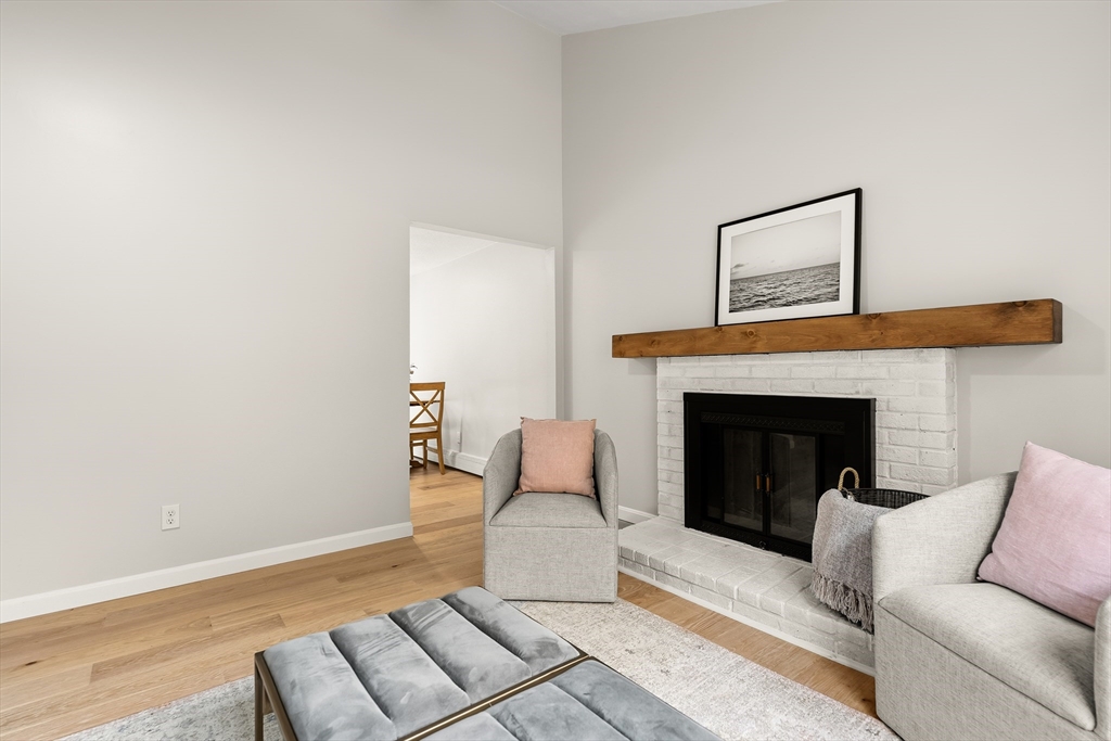 293 Mendall Road Acushnet, MA 02743 - Photo 7 of 41 a living room with furniture and a fireplace