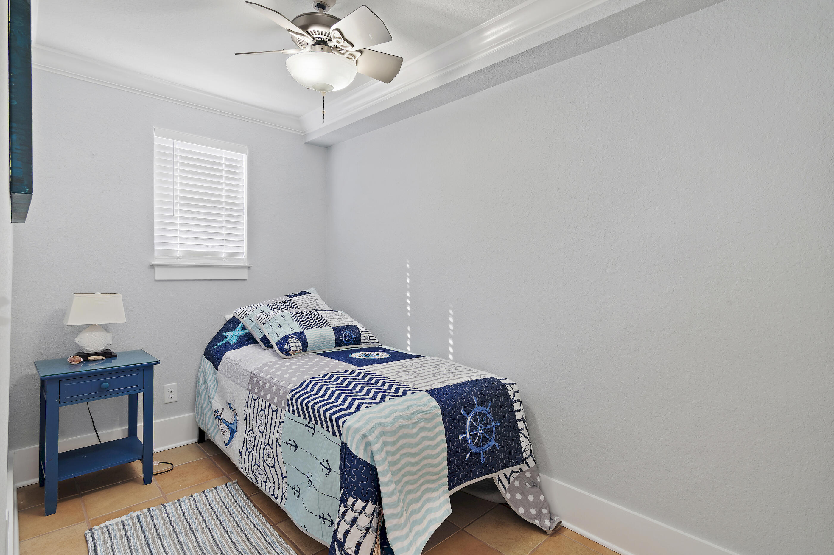 3680 East County Highway 30A, Unit 4 Santa Rosa Beach, FL 32459 - Photo 12 of 17 a bedroom with a bed and a chandelier