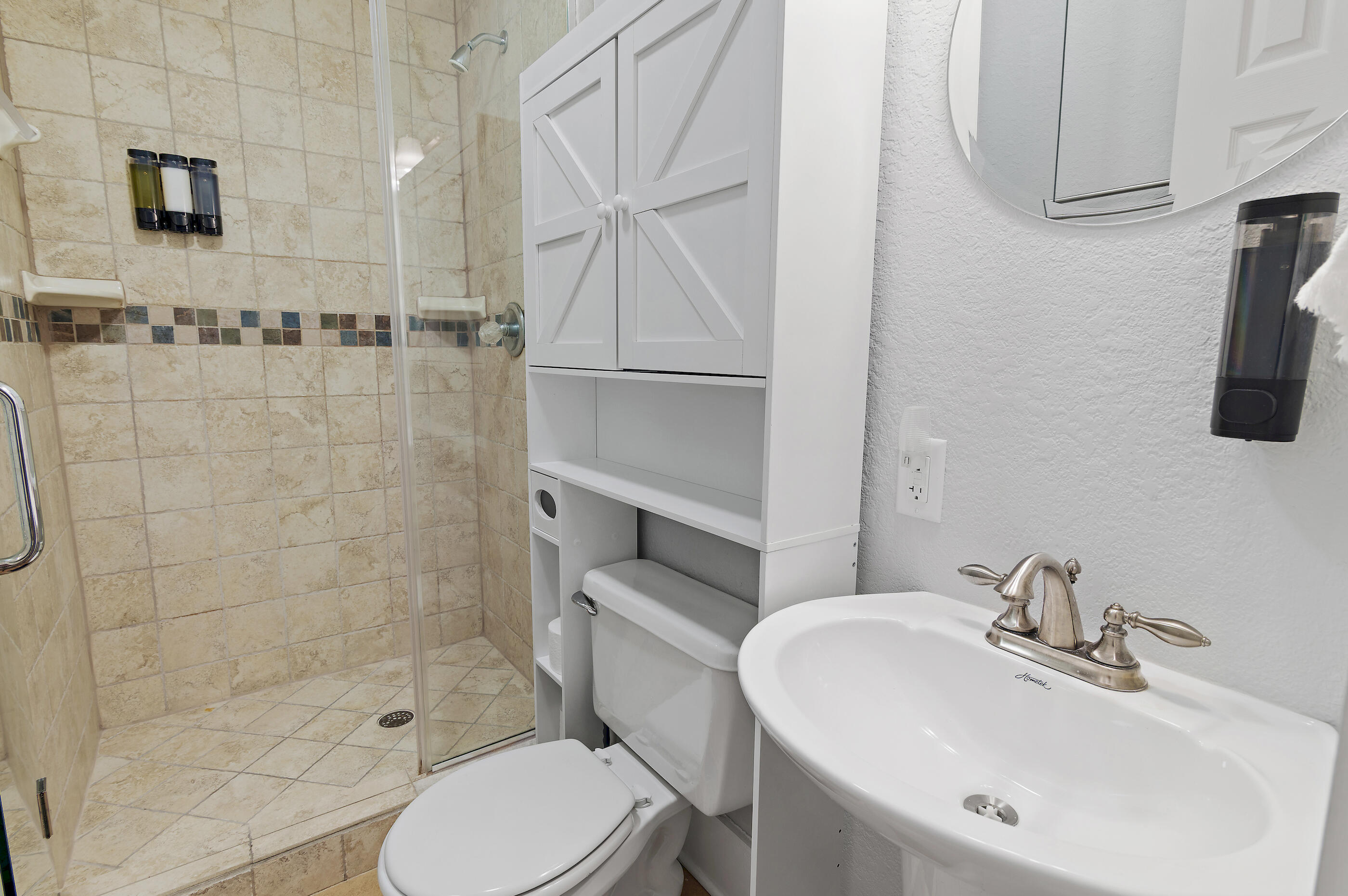 3680 East County Highway 30A, Unit 4 Santa Rosa Beach, FL 32459 - Photo 16 of 17 a bathroom with a sink toilet and shower