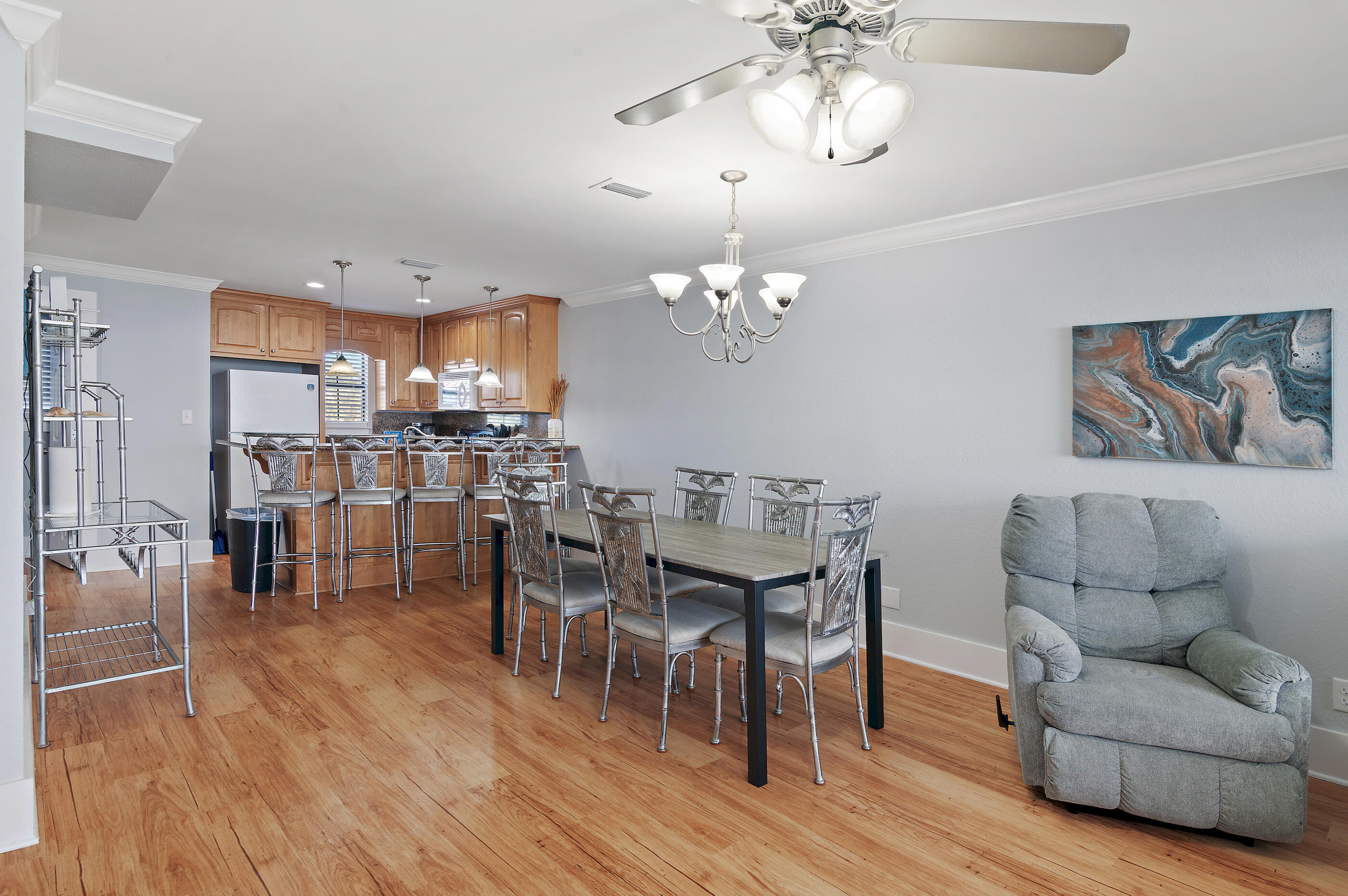3680 East County Highway 30A, Unit 4 Santa Rosa Beach, FL 32459 - Photo 5 of 17 a view of a dining room with furniture and wooden floor