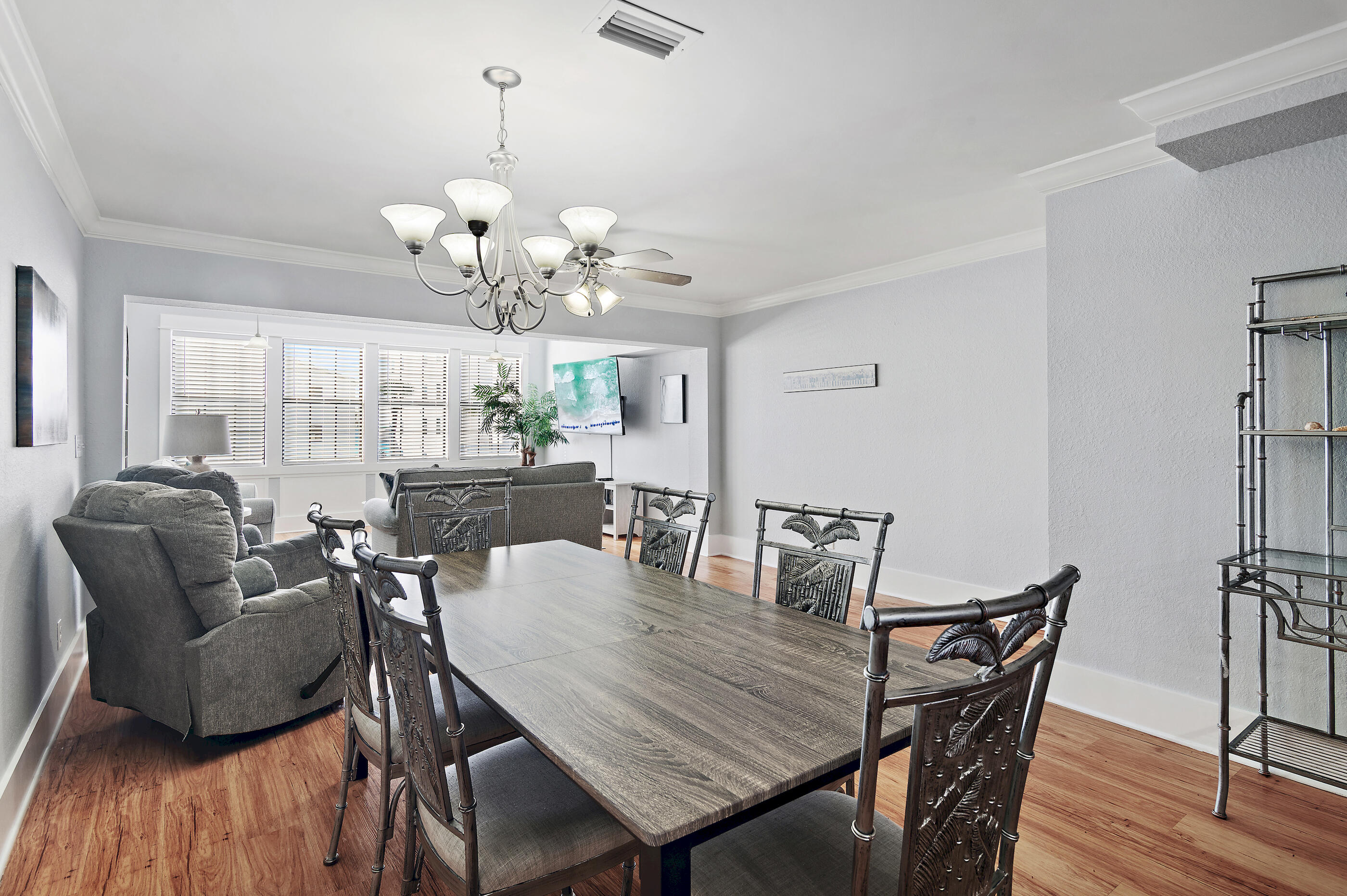 3680 East County Highway 30A, Unit 4 Santa Rosa Beach, FL 32459 - Photo 6 of 17 a view of a dining room with furniture and wooden floor