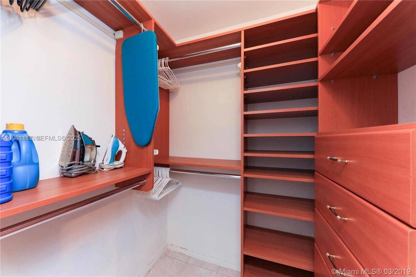 100 Lincoln Road, Unit 509 Miami Beach, FL 33139 - Photo 9 of 20 a view of walk in closet with empty racks