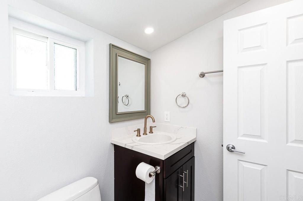 1020 41st Street San Diego, CA 92102 - Photo 11 of 39 a bathroom with a sink a toilet and shower