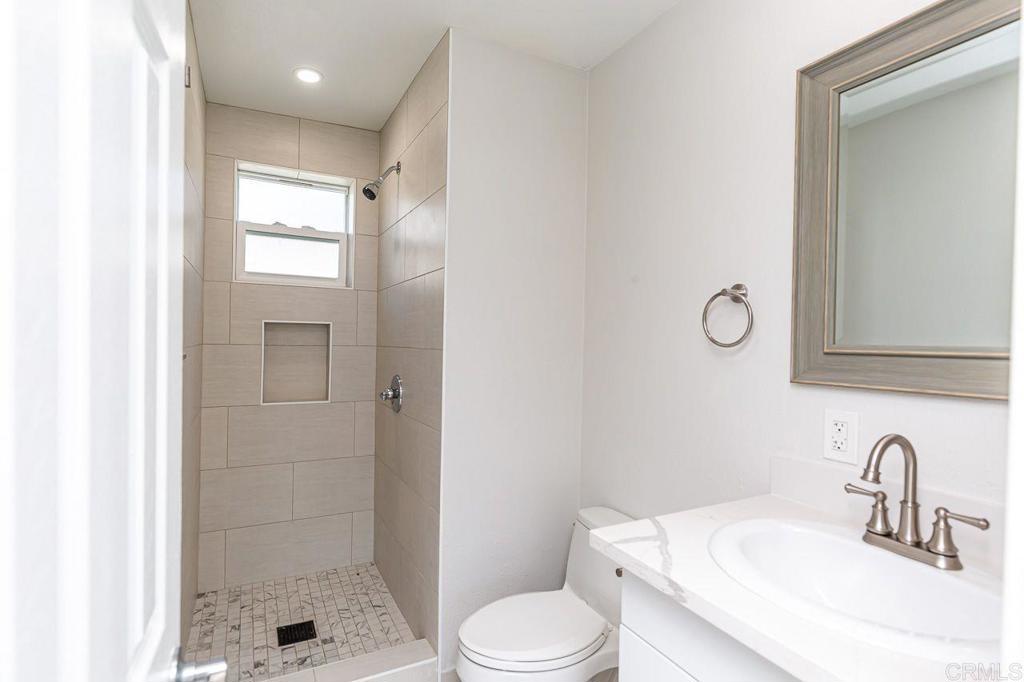 1020 41st Street San Diego, CA 92102 - Photo 21 of 39 a bathroom with a sink toilet and shower