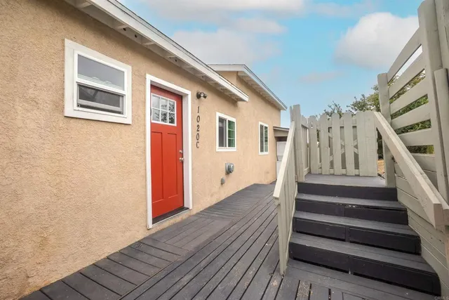 a view of entryway with wooden floor and stairs