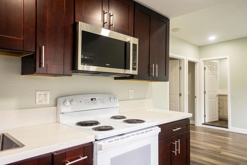 1020 41st Street San Diego, CA 92102 - Photo 32 of 39 a kitchen with a sink a stove and cabinets