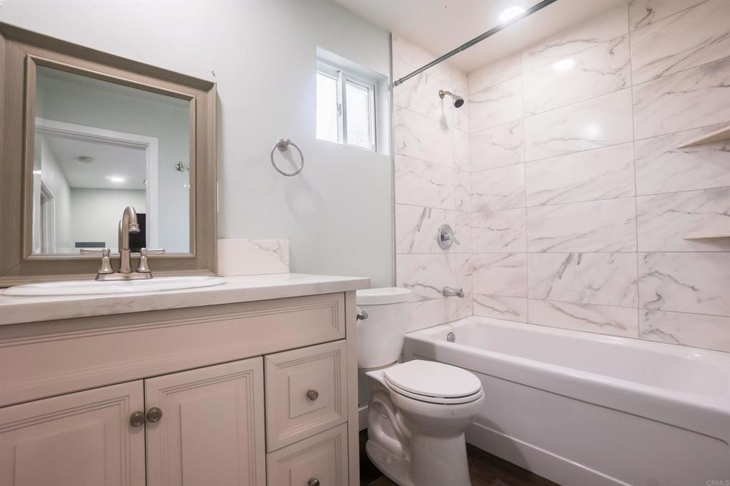 1020 41st Street San Diego, CA 92102 - Photo 37 of 39 a bathroom with a sink a toilet and a bathtub