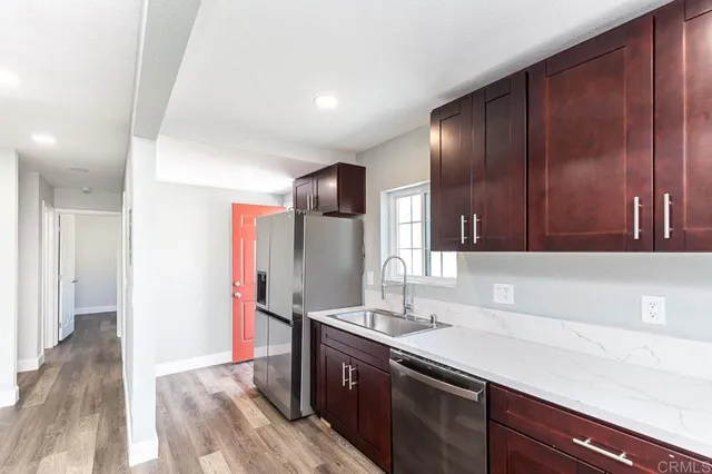 a kitchen with a sink and cabinets