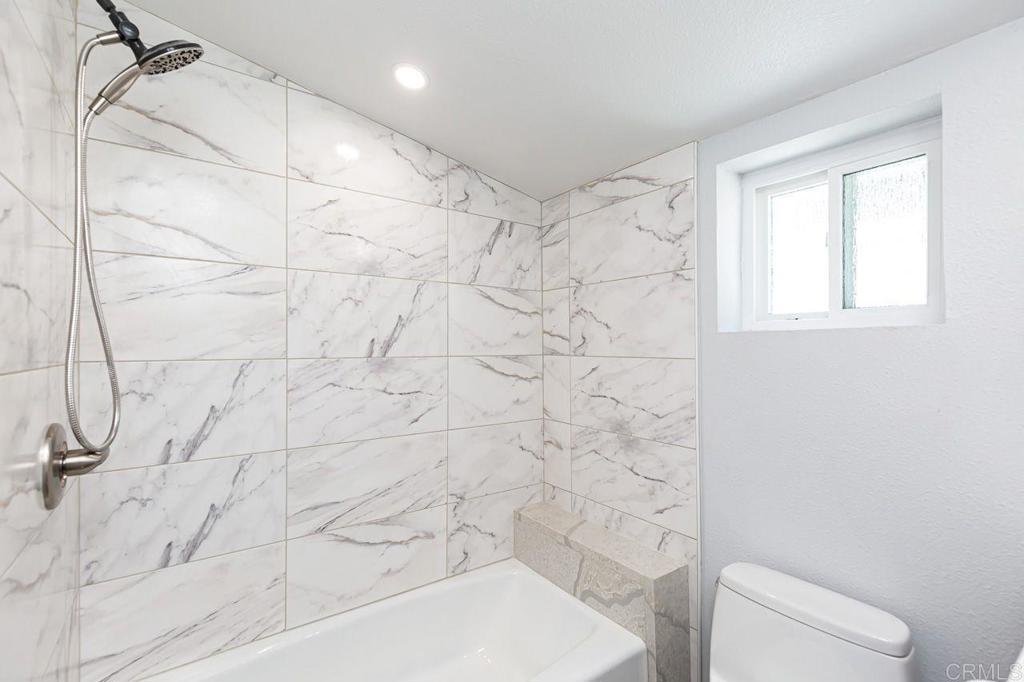 1020 41st Street San Diego, CA 92102 - Photo 10 of 39 a bathroom with a shower a toilet and sink