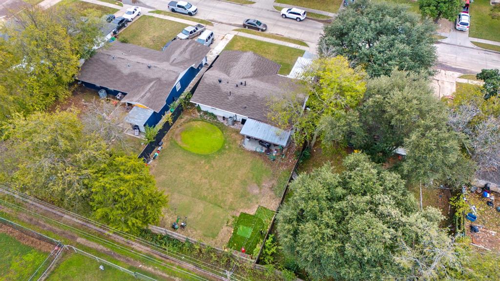 1831 Wintergreen Road Carrollton, TX 75006 - Photo 24 of 28 an aerial view of a house with a swimming pool