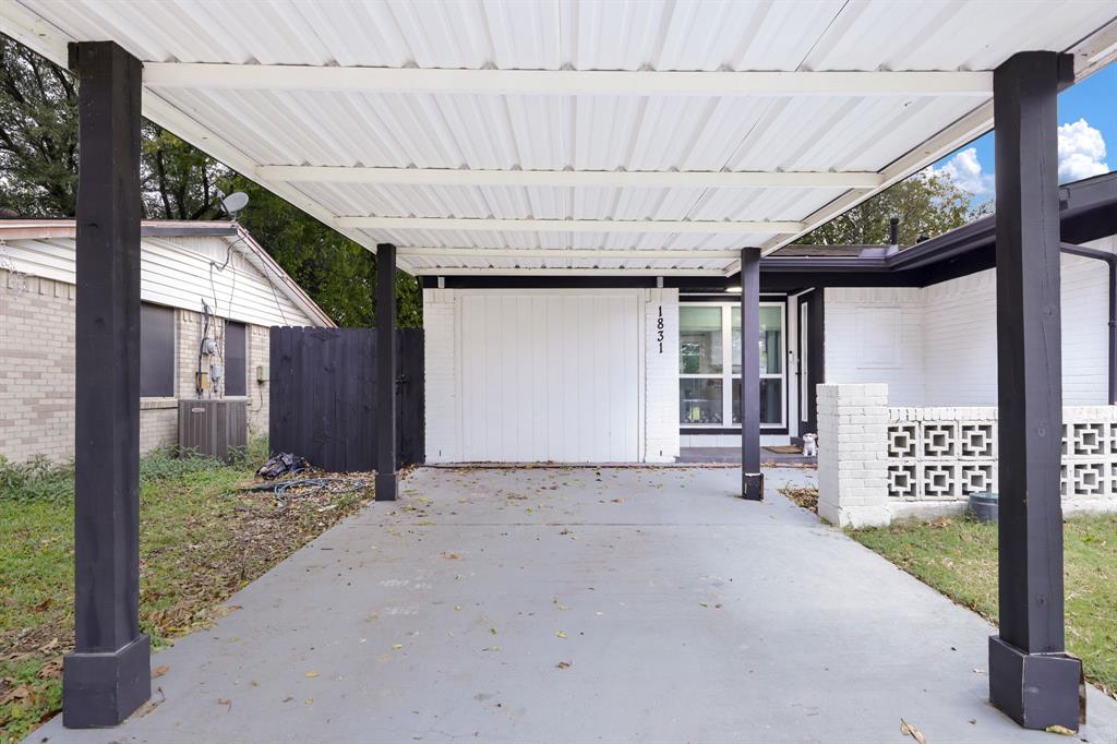 1831 Wintergreen Road Carrollton, TX 75006 - Photo 26 of 28 a view of backyard with window and garage