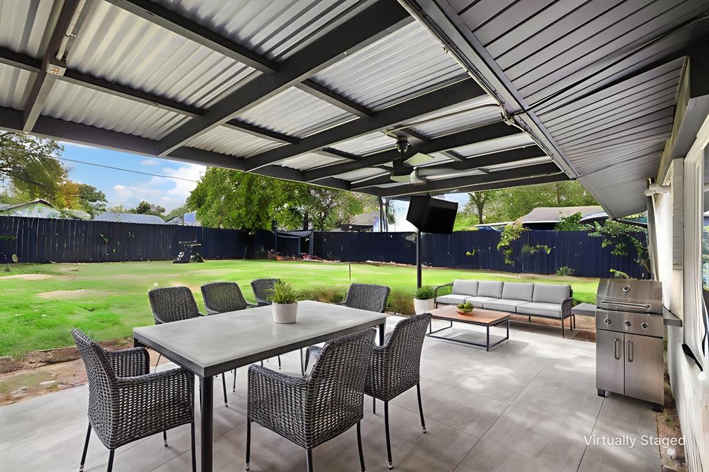 1831 Wintergreen Road Carrollton, TX 75006 - Photo 4 of 28 a patio with a table and chairs