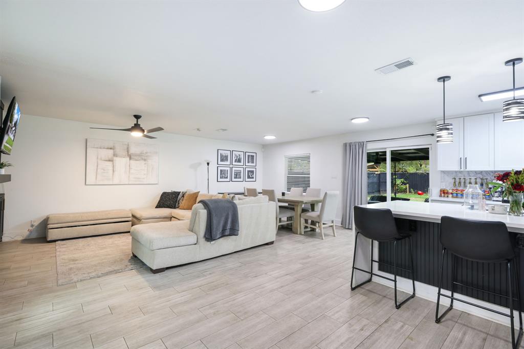 1831 Wintergreen Road Carrollton, TX 75006 - Photo 9 of 28 a living room with furniture and a large window