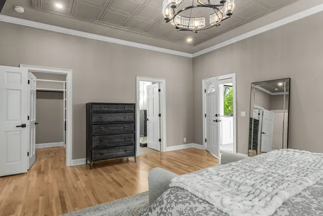 a spacious bathroom with a double vanity sink a mirror and a shower