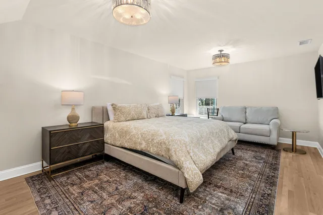 a bathroom with a double vanity sink mirror and toilet