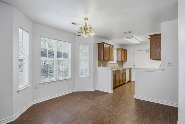 a view of a kitchen with a sink cabinet and a window