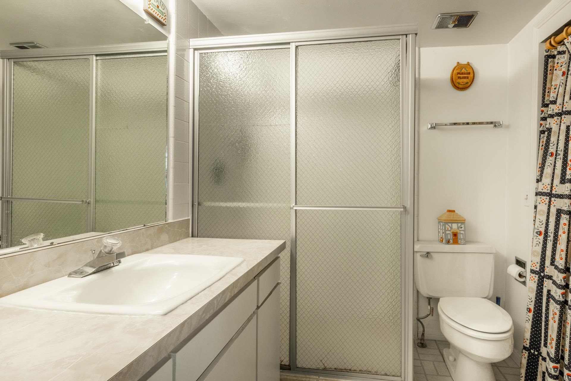 50 Hidden Valley Road, Unit 17 Mammoth Lakes, CA 93546 - Photo 21 of 40 Bathroom featuring a shower with textured glass sliding doors, a vanity with an integrated sink and
