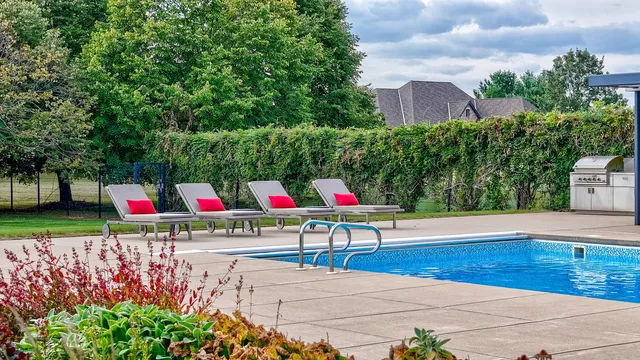 a room with furniture pool table and flat screen tv