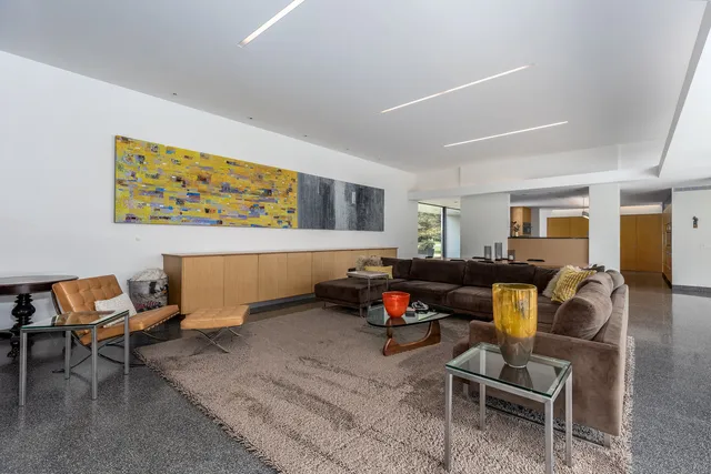 a living room with a couch and a large window