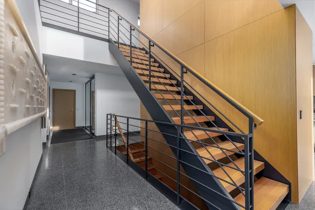 a kitchen with a table chairs sink and cabinets
