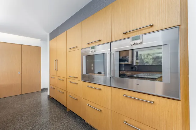 a kitchen with a sink and a window