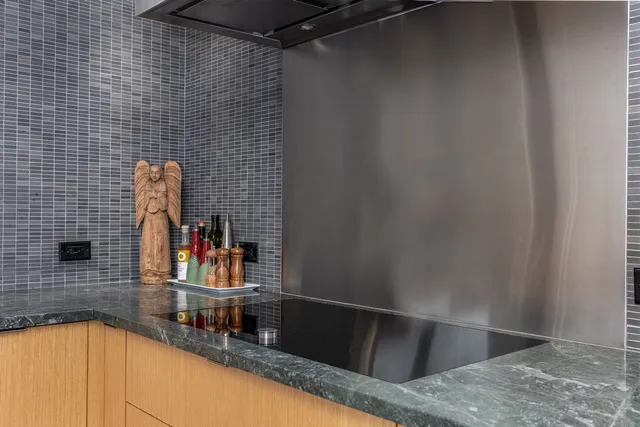 a bedroom with a bed and large window