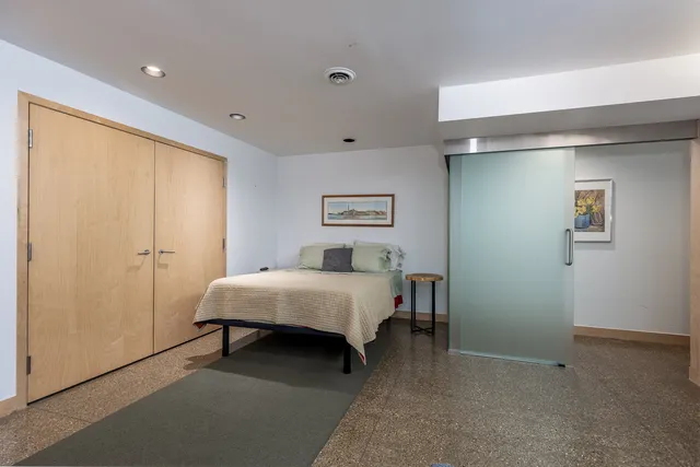 a view of a room with wooden floor and windows