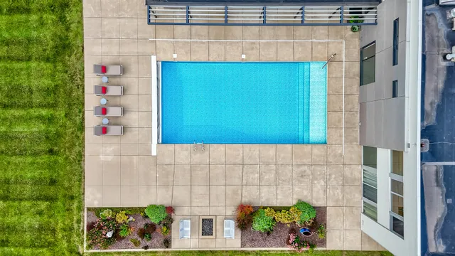 an aerial view of a house with pool garden