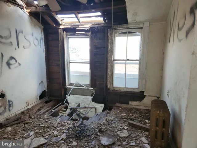 a living room with a couch and a window