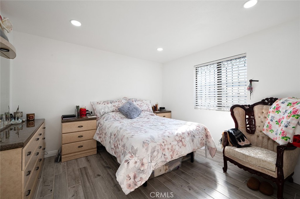 27447 Cypress Street Highland, CA 92346 - Photo 21 of 42 a bedroom with a bed and a couch