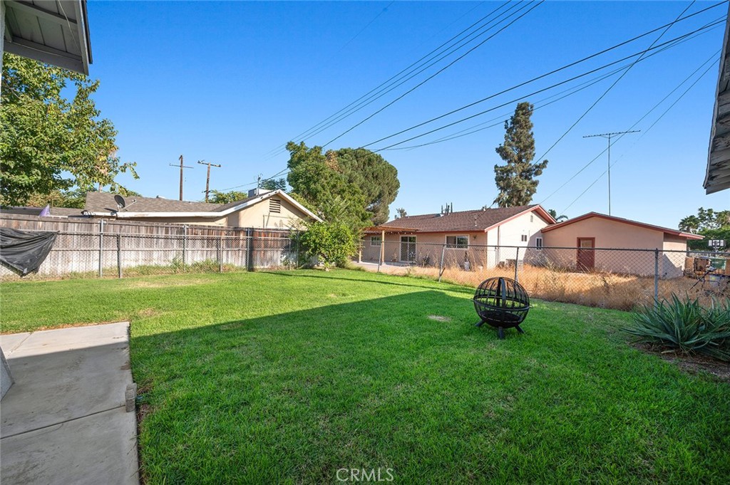 27447 Cypress Street Highland, CA 92346 - Photo 28 of 42 a front view of a house with garden