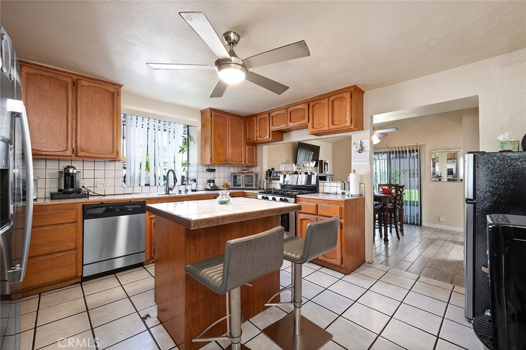 27447 Cypress Street Highland, CA 92346 - Photo 9 of 42 a kitchen with cabinets a sink and appliances