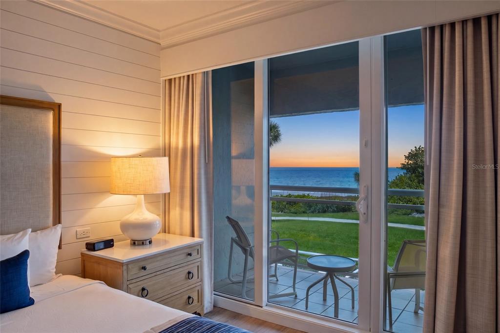 240 Sands Point Road, Unit 4104 Longboat Key, FL 34228 - Photo 4 of 47 a view of a balcony with a table and chairs