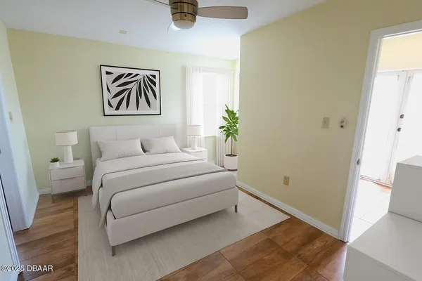 an empty room with wooden floor and a window