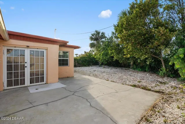 a view of a backyard of the house