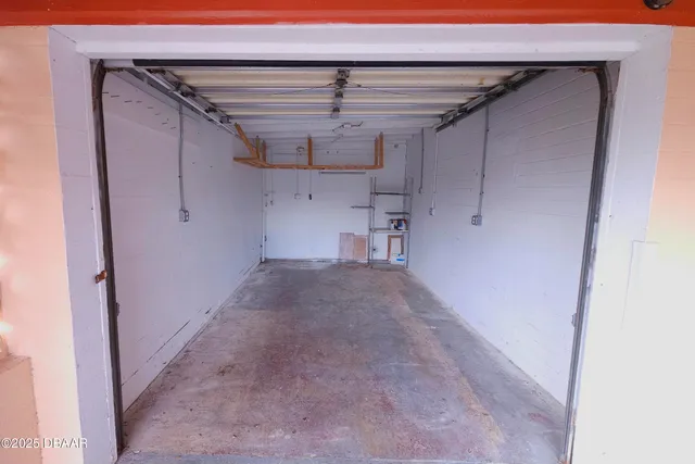 an aerial view of a house with outdoor space