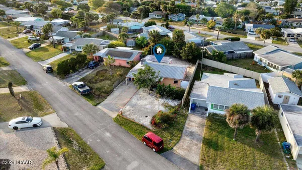 an aerial view of a house with a lake view