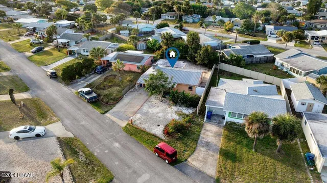 an aerial view of a house with a lake view