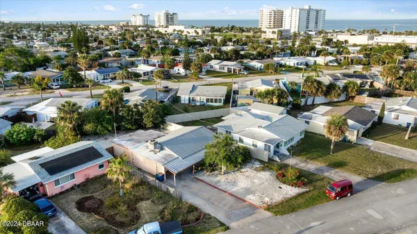 an aerial view of a house with a lake view