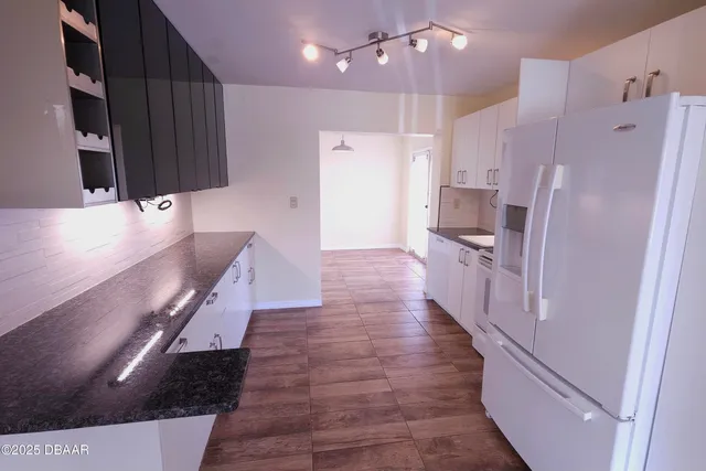 a large kitchen with cabinets