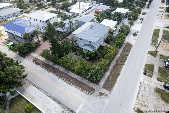 a view of a patio with a table and chairs