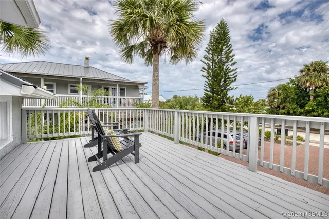 a bathroom with a toilet and a mirror