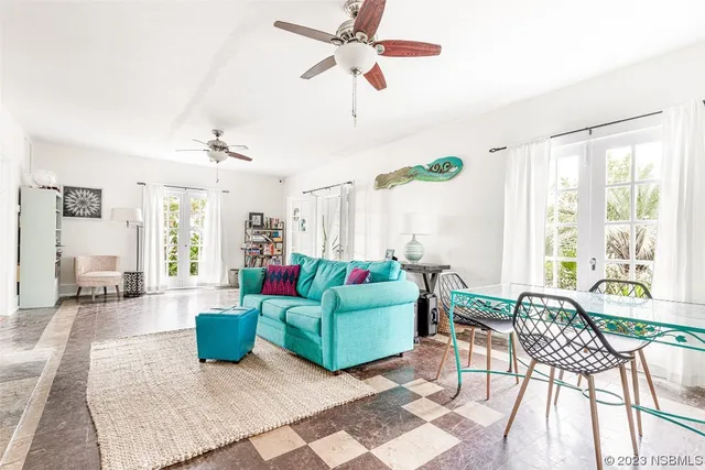 a view of a hallway with entryway and front door