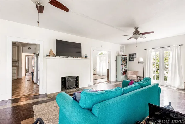 a kitchen with white cabinets and sink