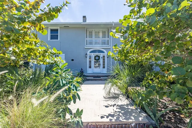 a view of balcony with wooden floor and outdoor seating