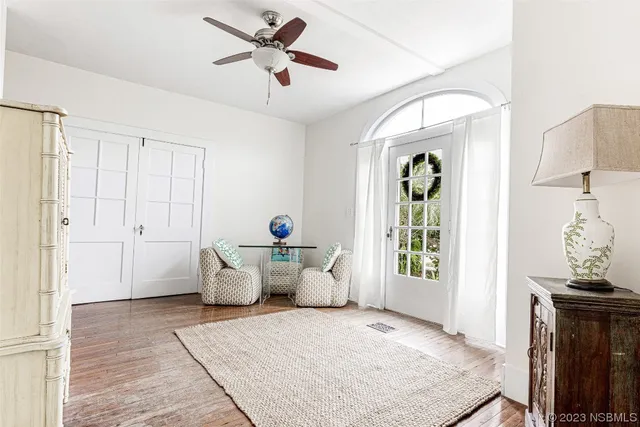 a bedroom with furniture and a chandelier