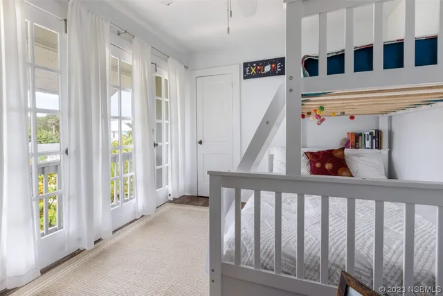 a view of a dining room with furniture and front door