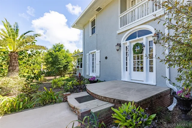a view of a chairs and table in the patio