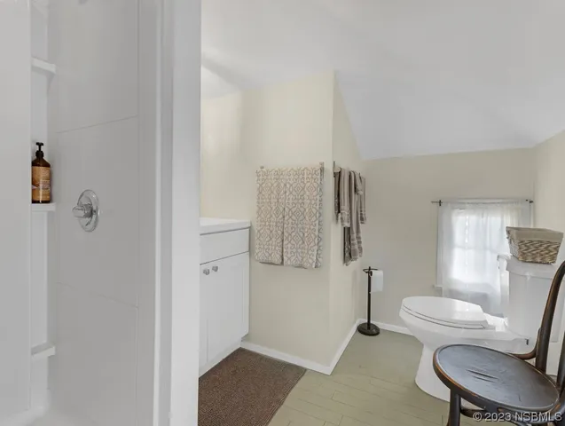 a bedroom with a bed and dresser