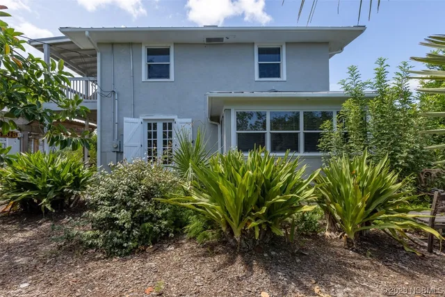 an aerial view of residential houses with city view